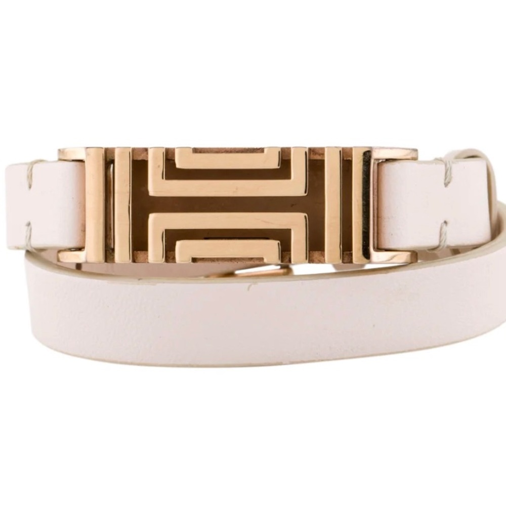 Tori Burch x Fitbit double wrap bracket. Gold fitting with neutral leather band.